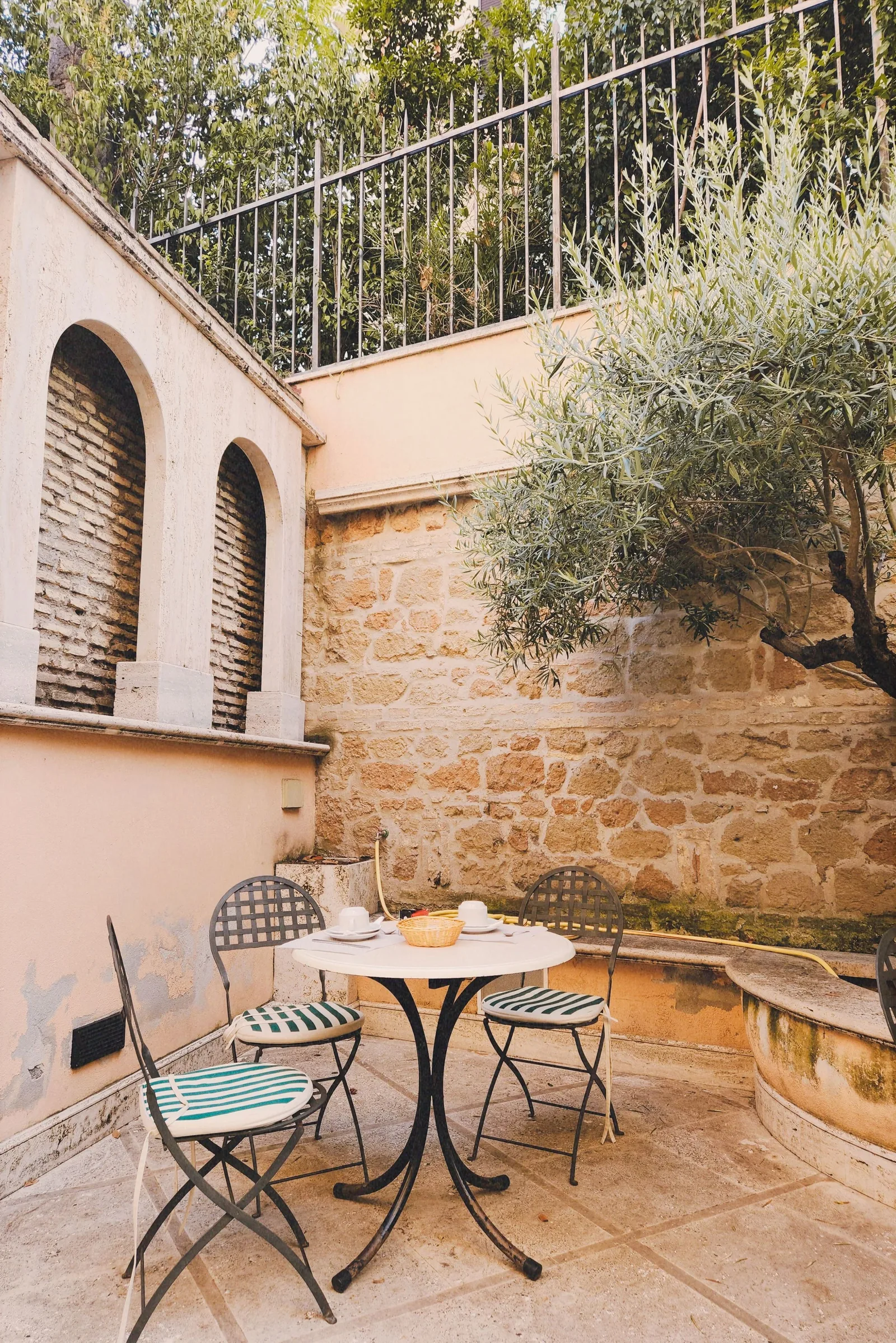 Small cafe table in a stone courtyard