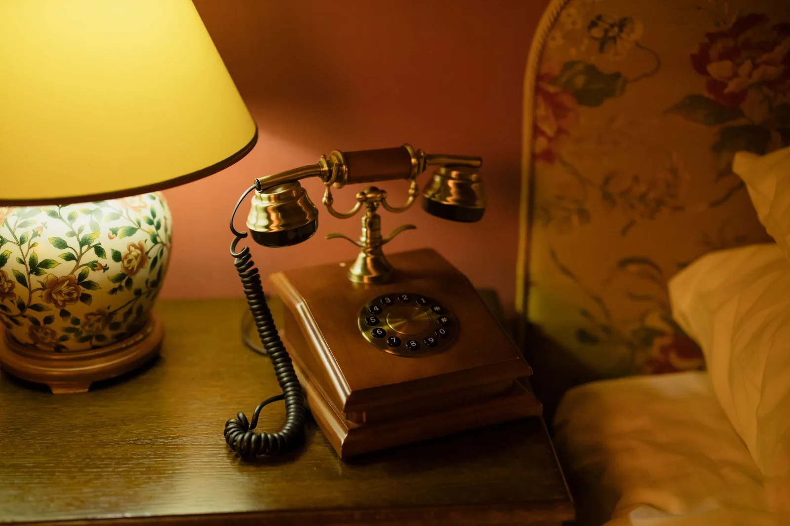 Old telephone on a bedside table